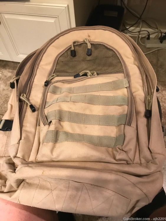 Military style pack by BUG OUT GEAR in desert tan, lots of pockets, adjust-img-0