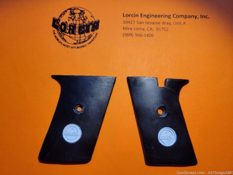 Lorcin Engineering Company L25 new smooth black 2 piece grips w/medallions-img-1