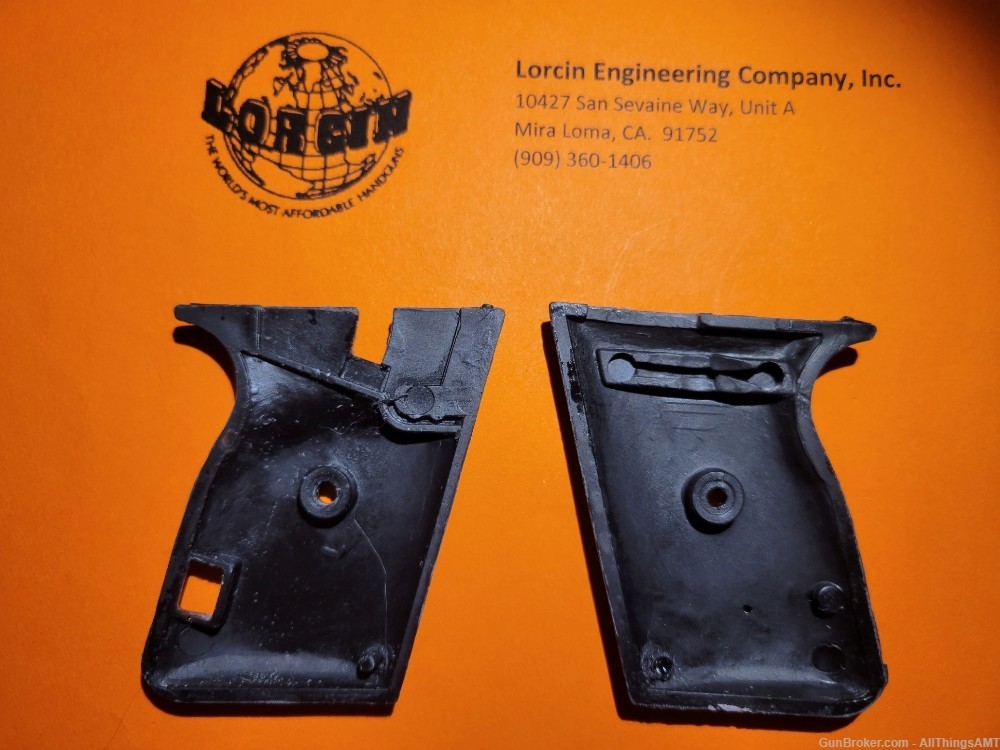 Lorcin Engineering Company L22 new smooth black grips with medallions-img-2