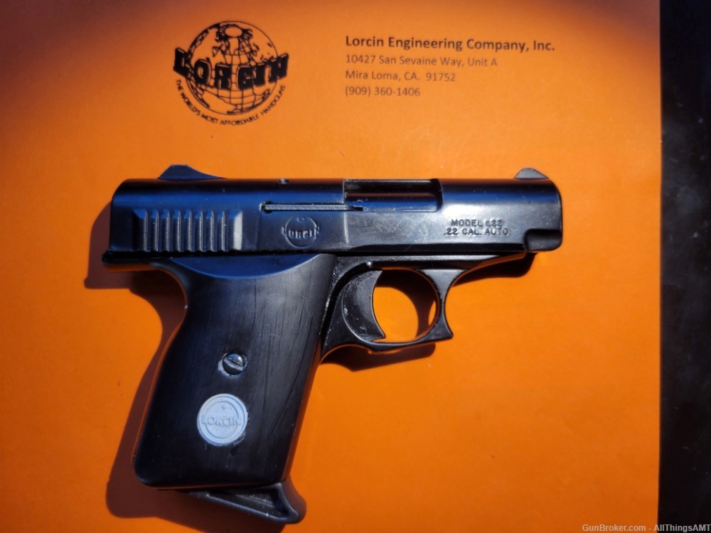 Lorcin Engineering Company L22 new smooth black grips with medallions-img-3