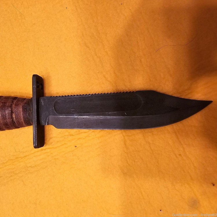 1986 Ontario Survival Knife with sheath and stone.-img-4