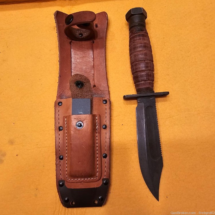 1986 Ontario Survival Knife with sheath and stone.-img-1