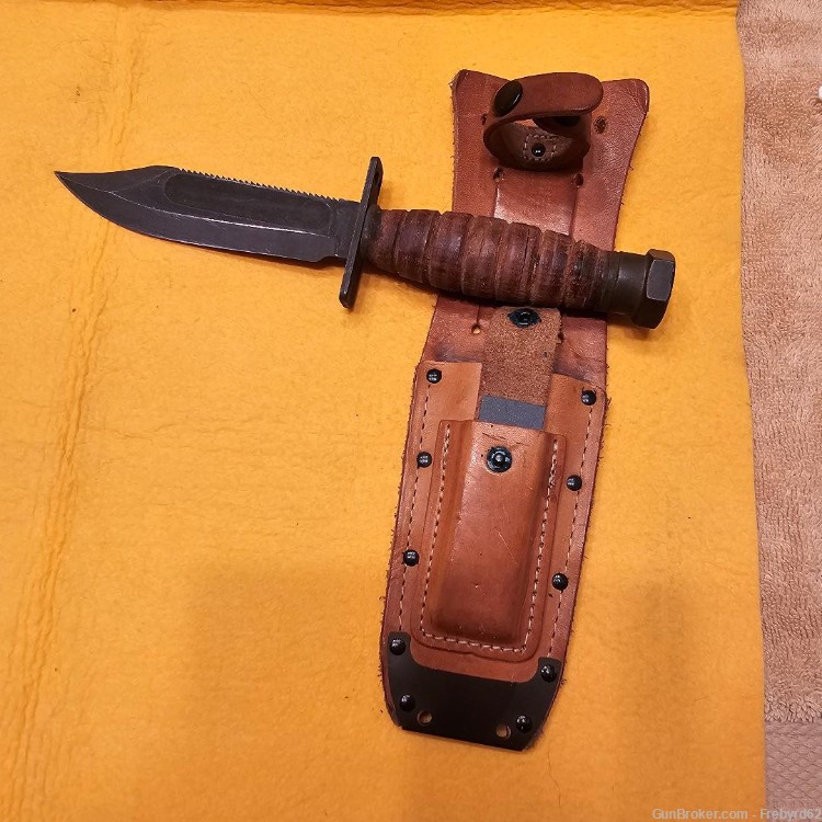 1986 Ontario Survival Knife with sheath and stone.-img-7