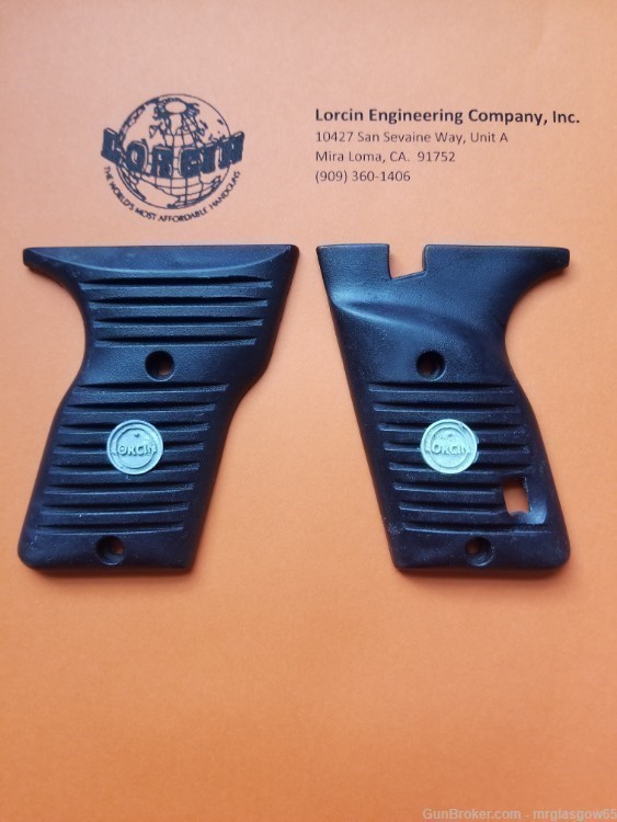 Lorcin Engineering Company L32, L380 new black grips with medallions-img-0