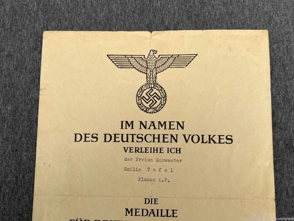 Original WWII German Social Welfare Medal w/ Award Certificate and Ribbon -img-1