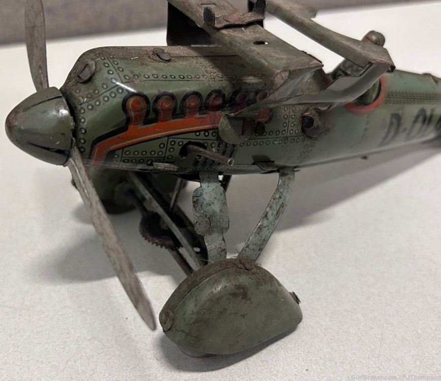 Vintage Original WW2 German Tipp Co D-OLAF Wind-Up Tin Bomber Plane -img-1