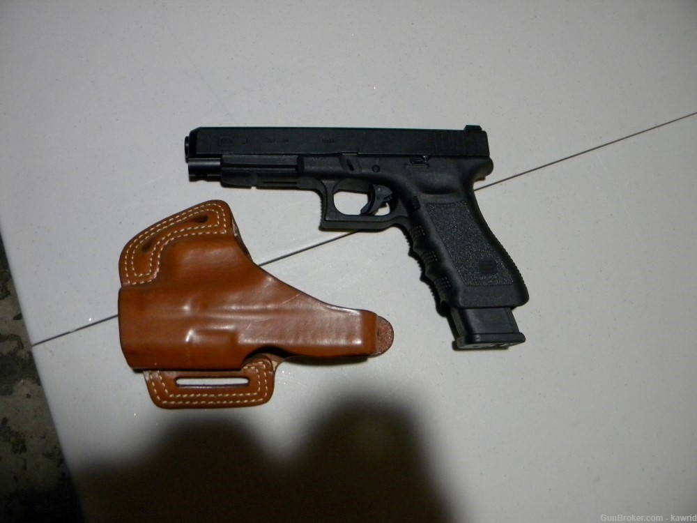USED GLOCK 34 , 2 MAGS AND BLACKHAWK HOLSTER-img-0