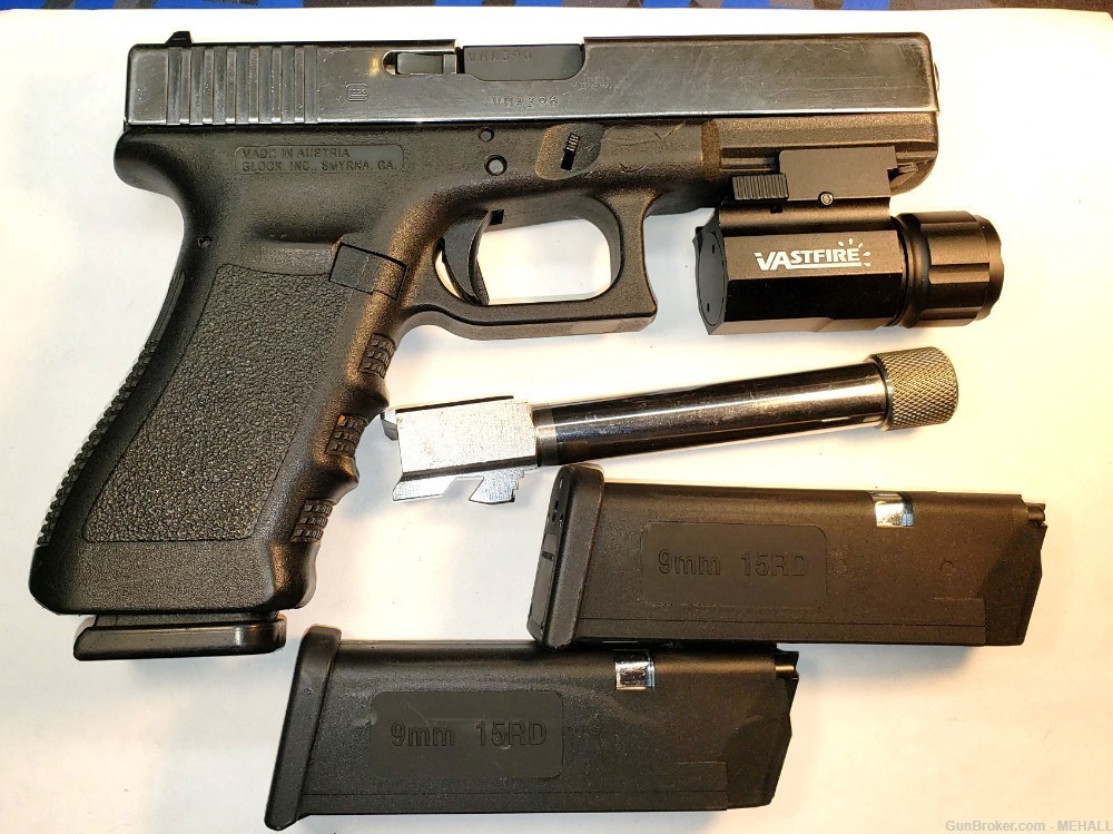 Glock Mod 22  9 MM combo with 40s&w barrel ,mags flashlight mounted-img-0