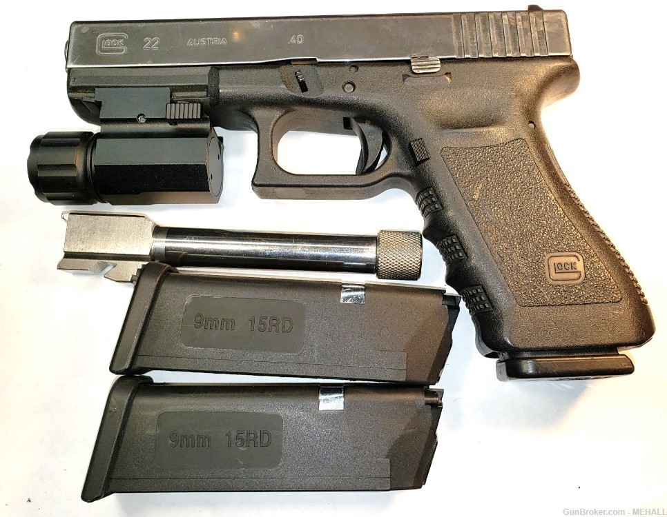 Glock Mod 22  9 MM combo with 40s&w barrel ,mags flashlight mounted-img-2