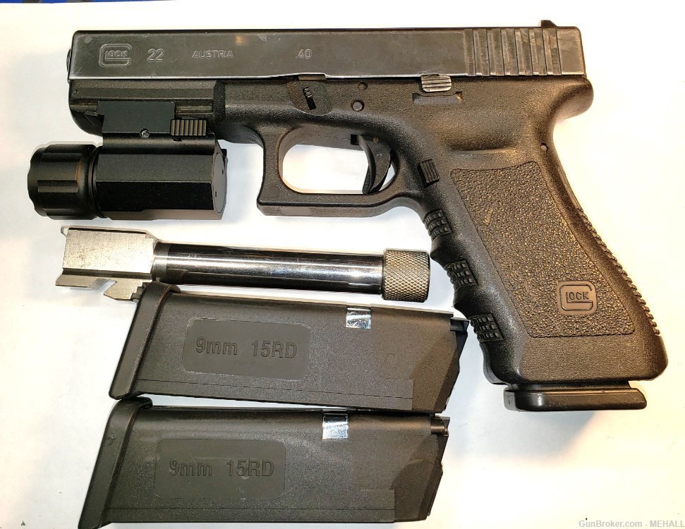 Glock Mod 22  9 MM combo with 40s&w barrel ,mags flashlight mounted-img-1
