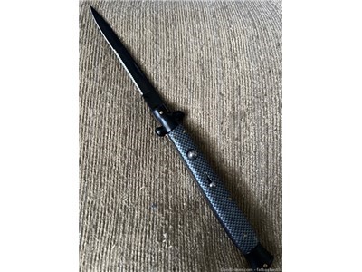 Switchblade with serrated blade 