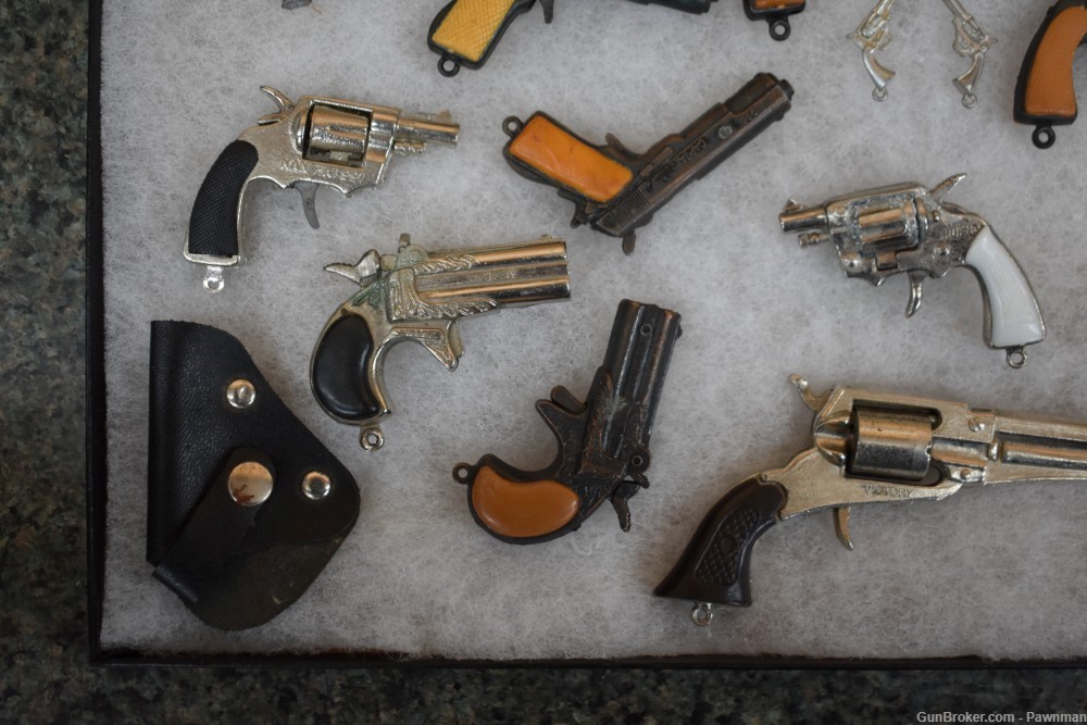 Vintage display of 33 miniature handguns + four miniature holsters-img-7