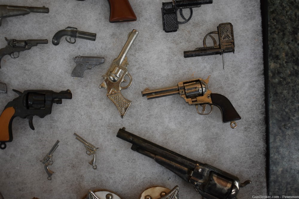 Vintage display of 33 miniature handguns + four miniature holsters-img-6