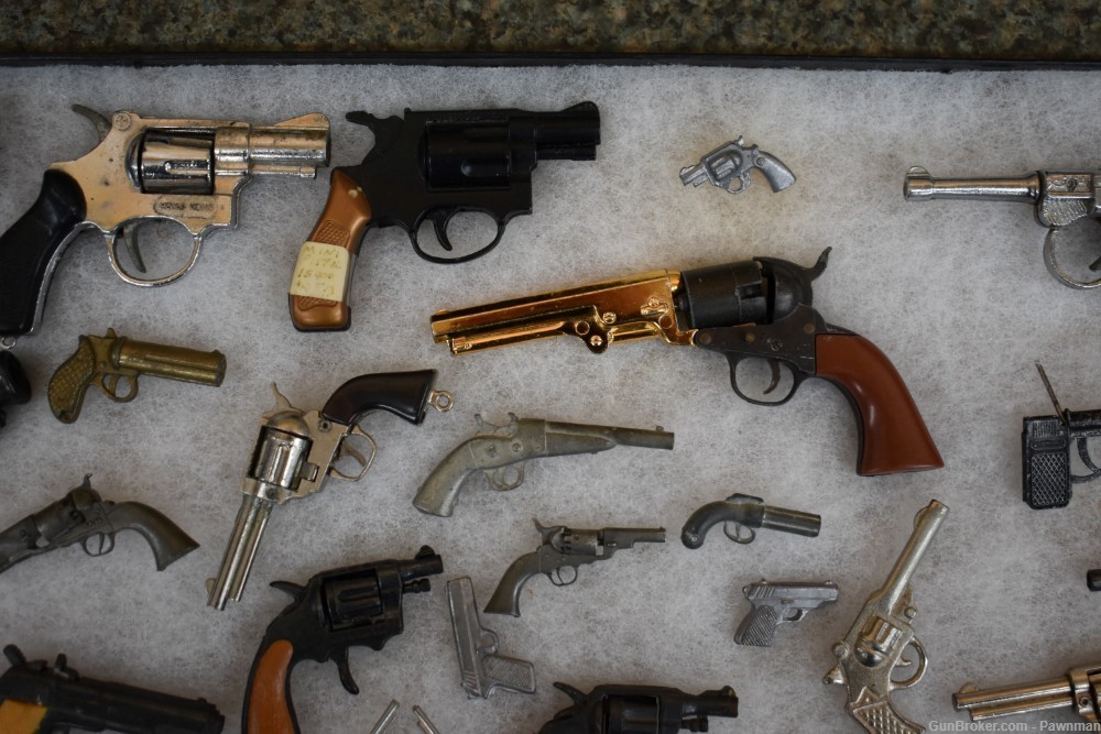Vintage display of 33 miniature handguns + four miniature holsters-img-2