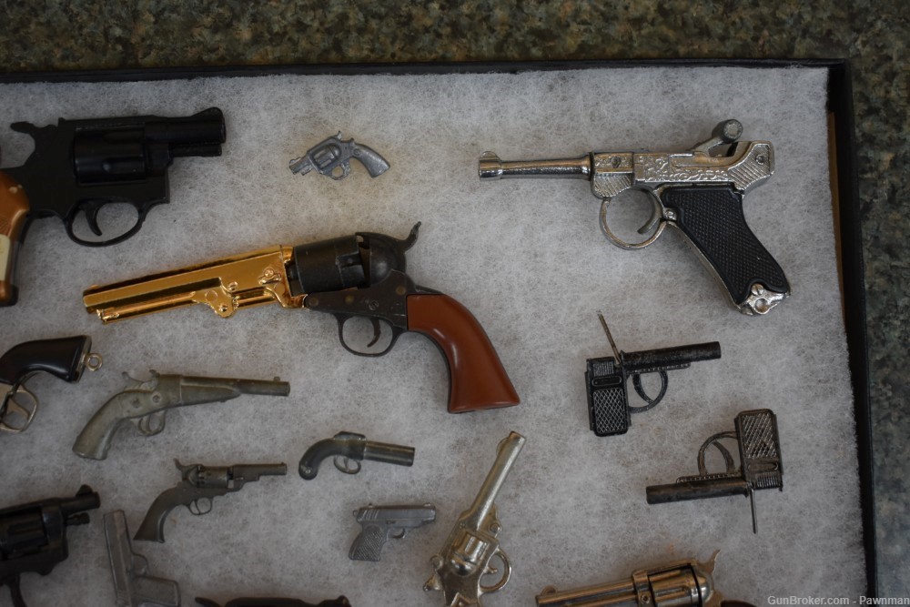 Vintage display of 33 miniature handguns + four miniature holsters-img-3