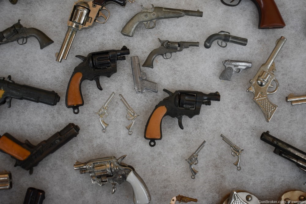 Vintage display of 33 miniature handguns + four miniature holsters-img-5