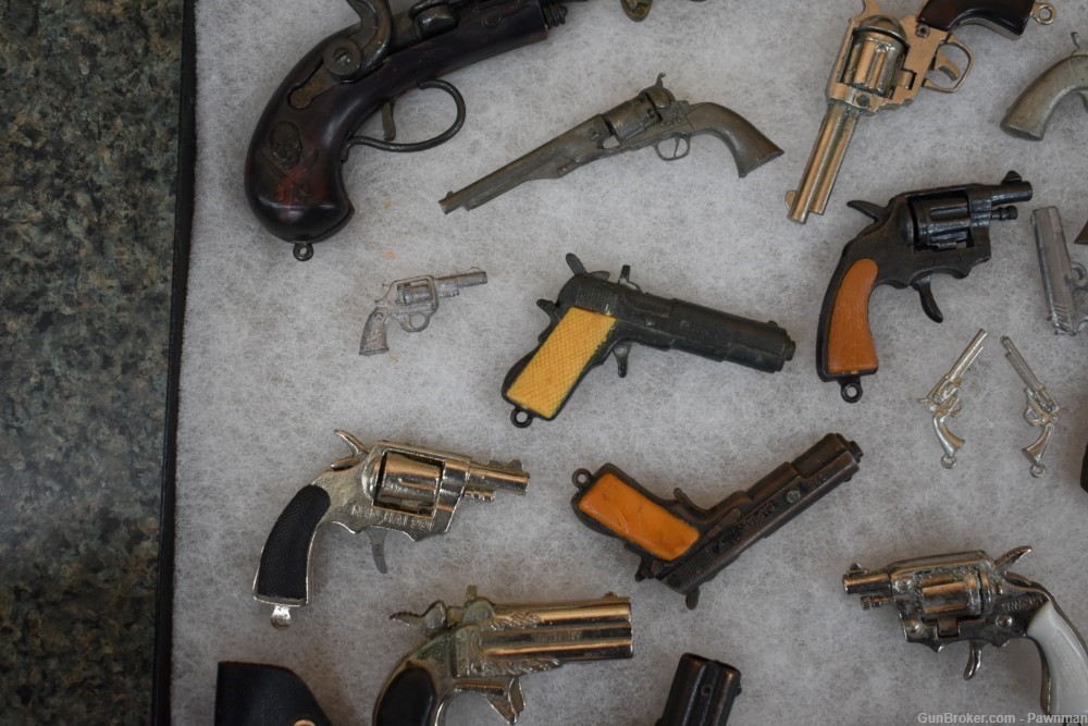 Vintage display of 33 miniature handguns + four miniature holsters-img-4