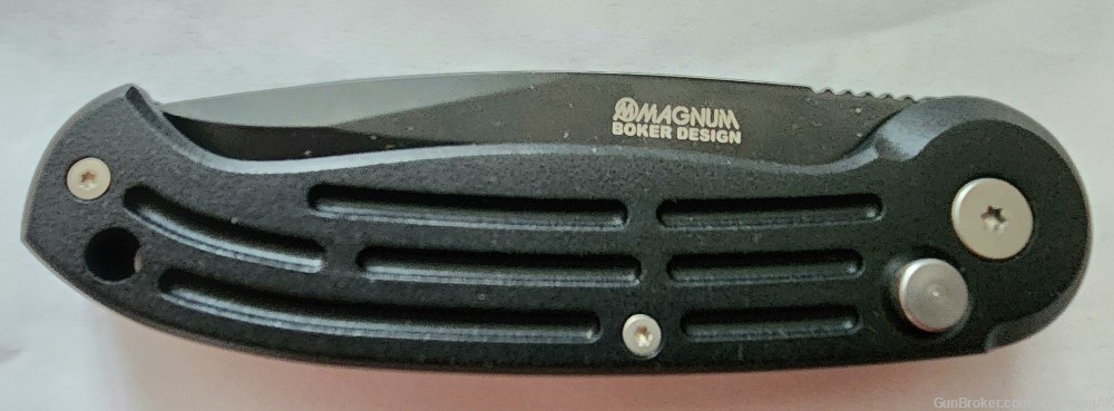 New in box Boker Magnum B0017 auto opening, black, combination edge knife. -img-2