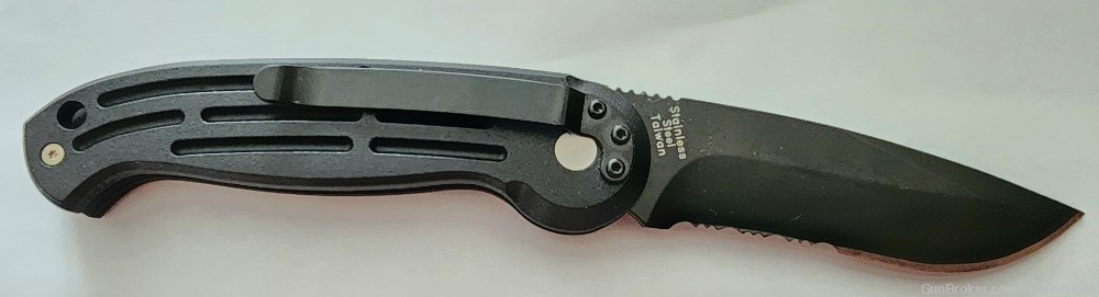 New in box Boker Magnum B0017 auto opening, black, combination edge knife. -img-1