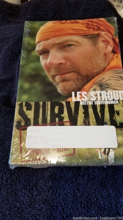 Signed book- Survive! by Les Stroud.-img-0