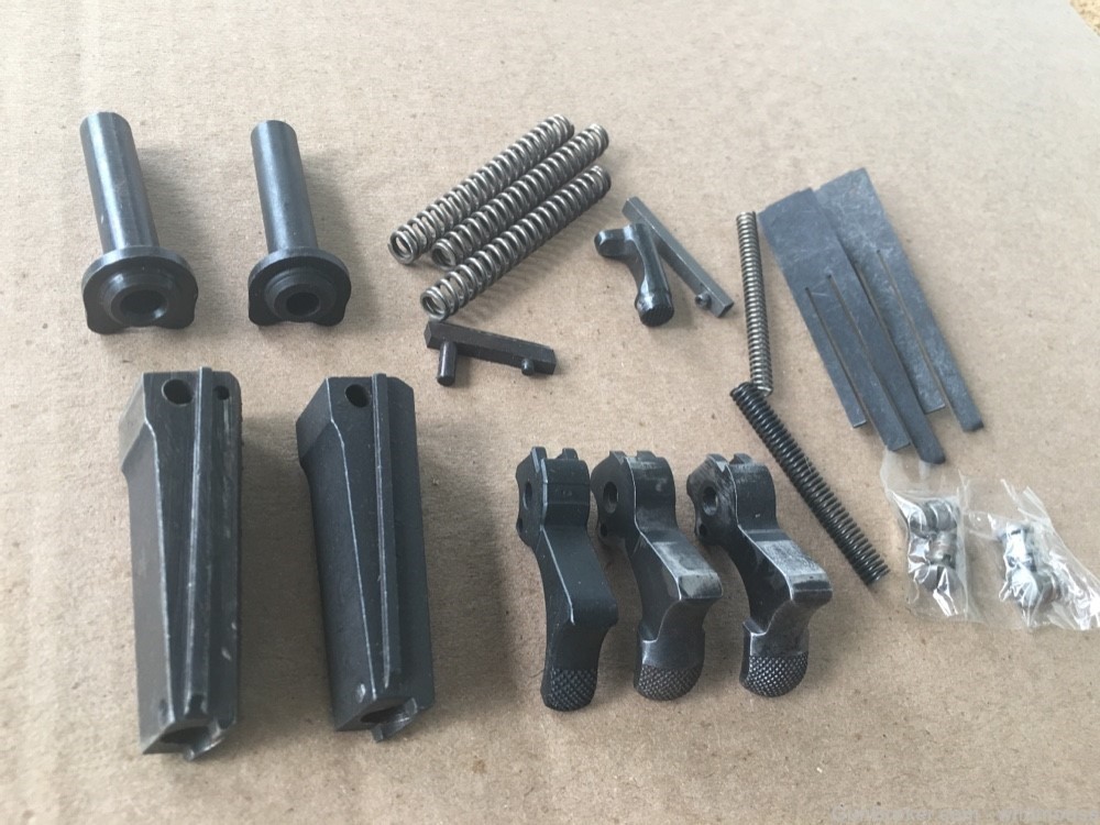 Misc 1911 pistol parts , new and used , hammer , springs etc.-img-3