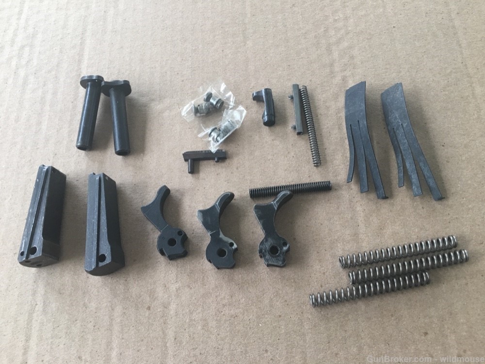 Misc 1911 pistol parts , new and used , hammer , springs etc.-img-1