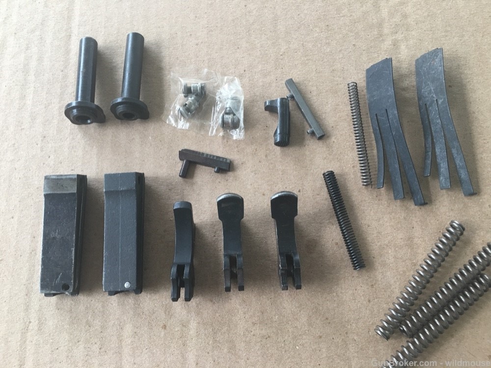 Misc 1911 pistol parts , new and used , hammer , springs etc.-img-2