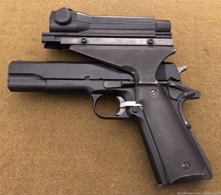 Rare MGC Model Gun 1911 blank firing pistol with Aimpoint Acepoint optic -img-0