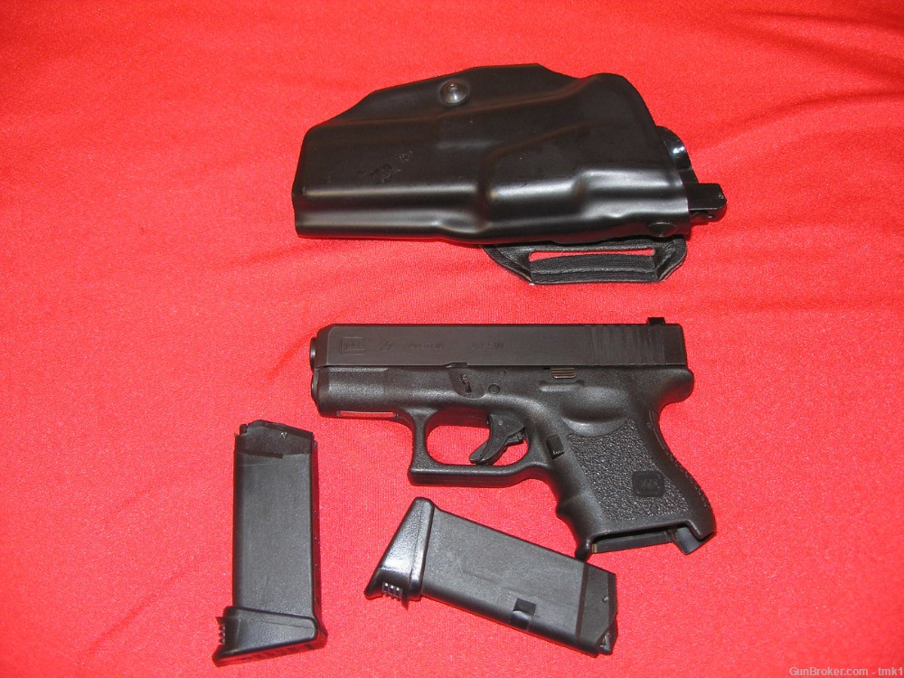 USED GLOCK 27 WITH 2 MAGAZINES AND SAFARILAND HOLSTER-img-0