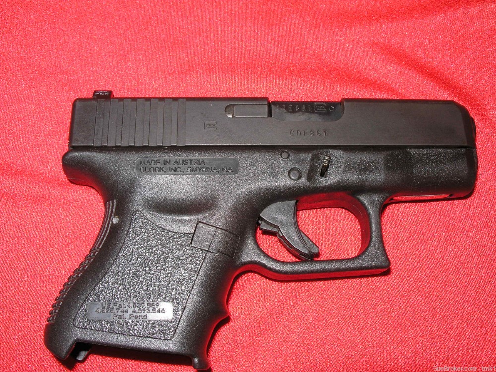 USED GLOCK 27 WITH 2 MAGAZINES AND SAFARILAND HOLSTER-img-1