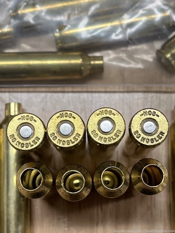 New unused Nosler factory primed 28 Nosler brass 50 pc-img-0
