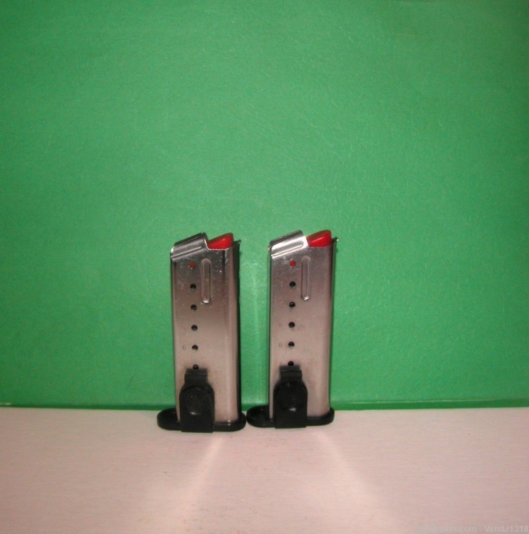2 Factory Smith & Wesson SW9M 7rd SIGMA 9mm Magazines w/Clip-img-0