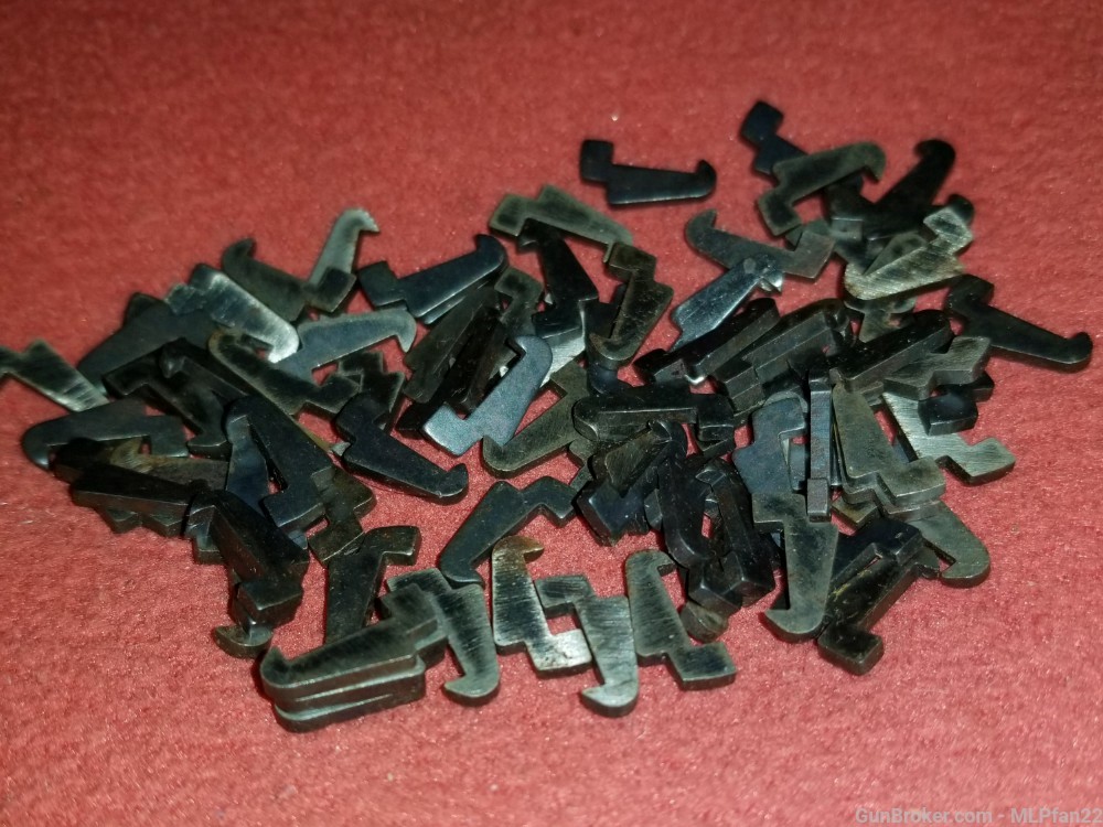 Lot of at least 50 Ruger 22 standard model pistol extractors parts-img-1