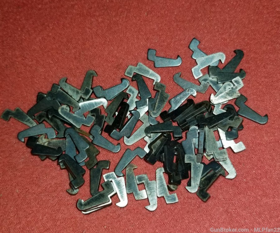 Lot of at least 50 Ruger 22 standard model pistol extractors parts-img-0