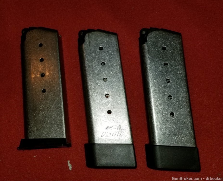 3 Kahr factory magazines for PM 45 one 5 round 2 are 6 round new factory -img-0
