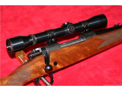 NO RESERVE VERY NICE WINCHESTER MODEL 70 IN 7MM WITH SCOPE