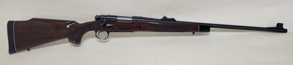 Remington 700 300 Rem Short Action Ultra Mag 24" Barrel Wood Stock-img-0