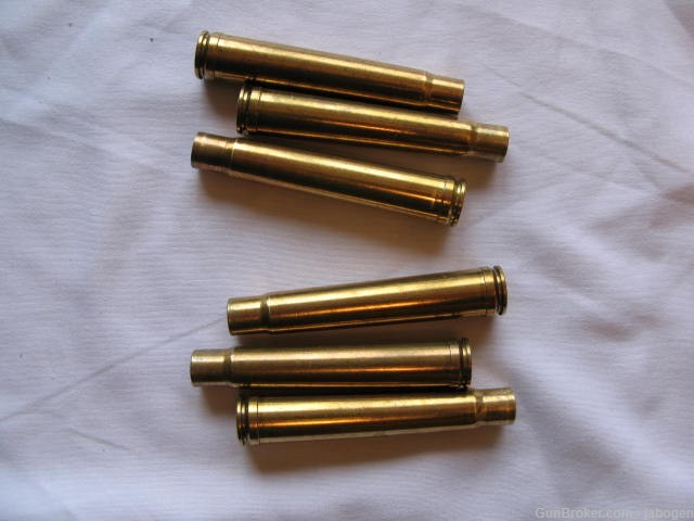 375 H+H primed once fired brass. Six cases and 18, 270 grain bullets-img-1