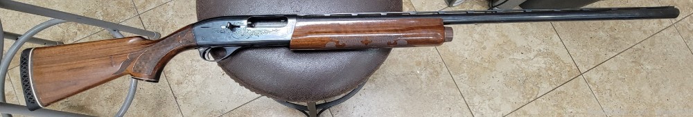 Remington 1100 12 Gauge Magnum Shotgun Engraved Blue -img-0