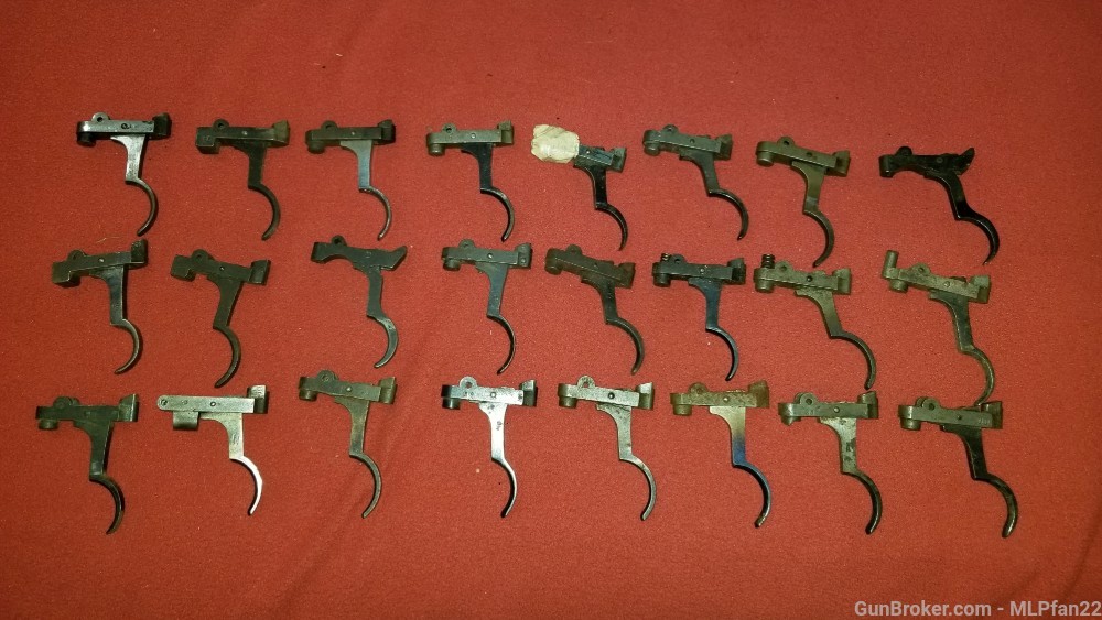 lot of 24 Mauser rifle triggers and sears assorted parts-img-0