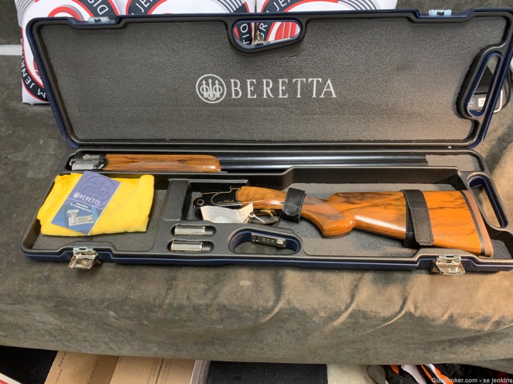 Beretta Gold & Black Over Under 12 Gauge shotgun.-img-0