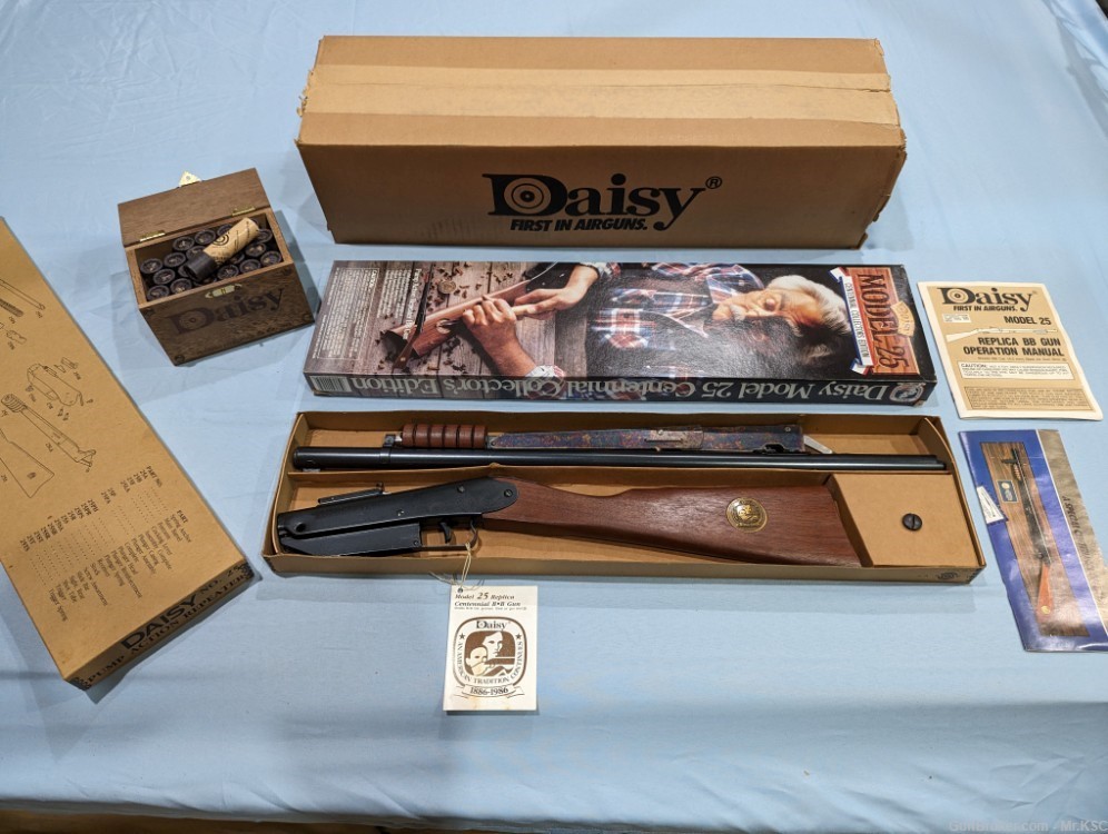 Daisy Centennial BB Gun  with wooden BB box and 22 tubes of steel shot.  -img-0