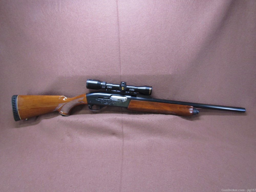 Remington 1100 12 GA 2 3/4 In Semi Auto Shotgun Fully Rifled 2-7x Scope-img-0