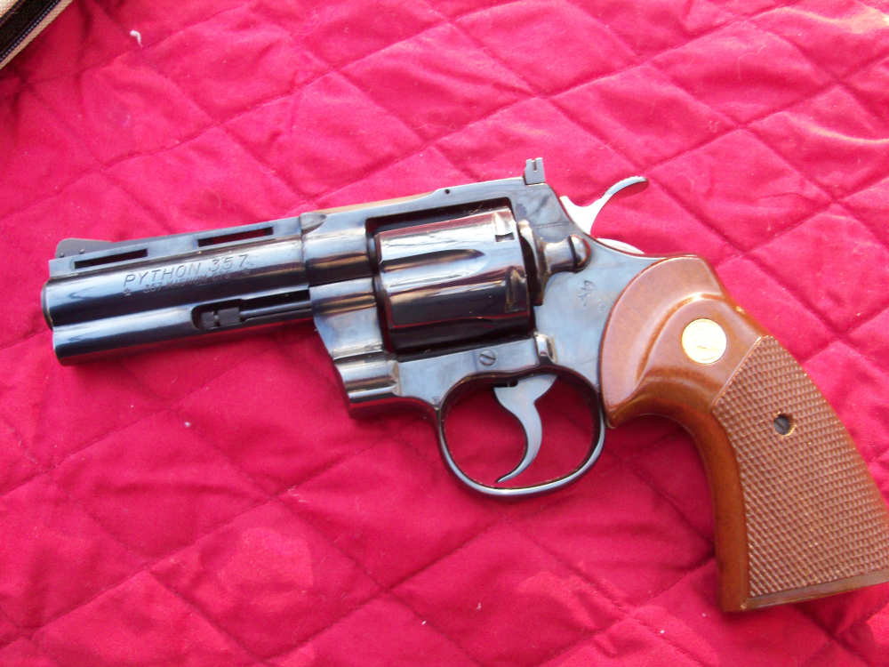 Colt Python early model - 4 inch blue - wood grips - Revolvers at ...