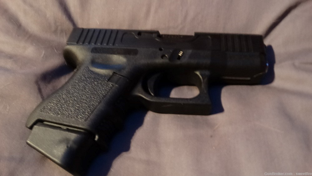 glock g26 gen 3 with aftermarket slide and magazine -img-1