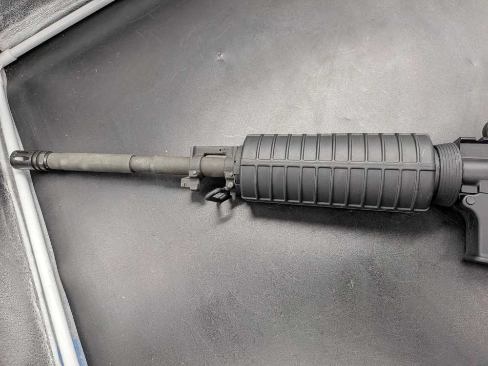 Bushmaster XM-15 5.56 NATO tactical rifle with Bushnell holo sight-img-5