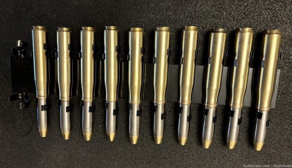 20mm Oerlikon brass case with 20mm steel 11 round clip (ten round clipped) -img-0