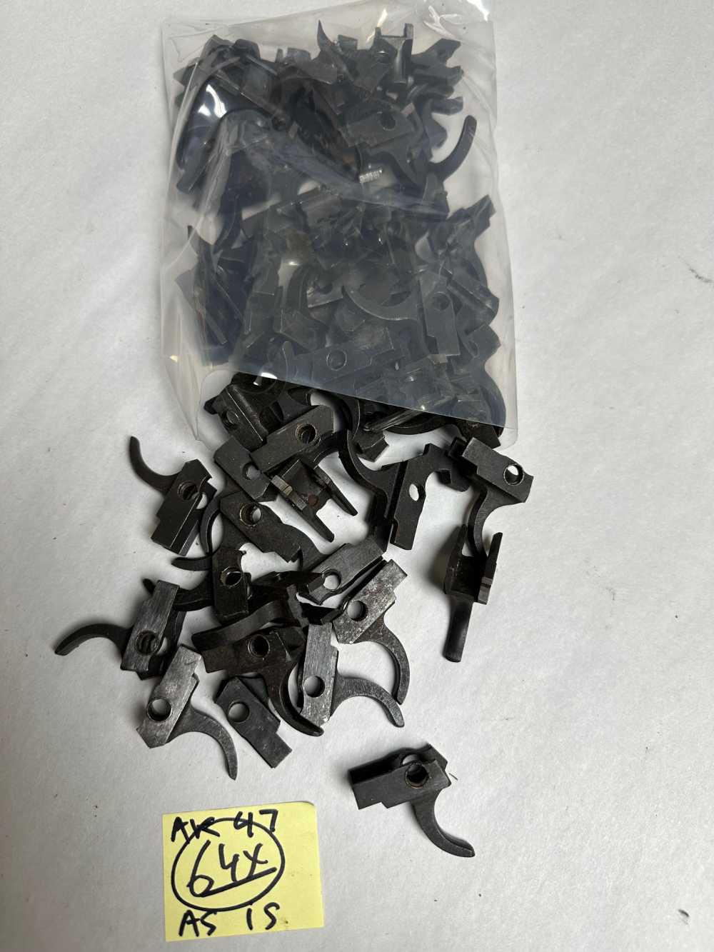 LOT OF 64 AK47 DAMAGED TRIGGERS SOLD "AS IS" FOR THAT PROJECT.-img-0