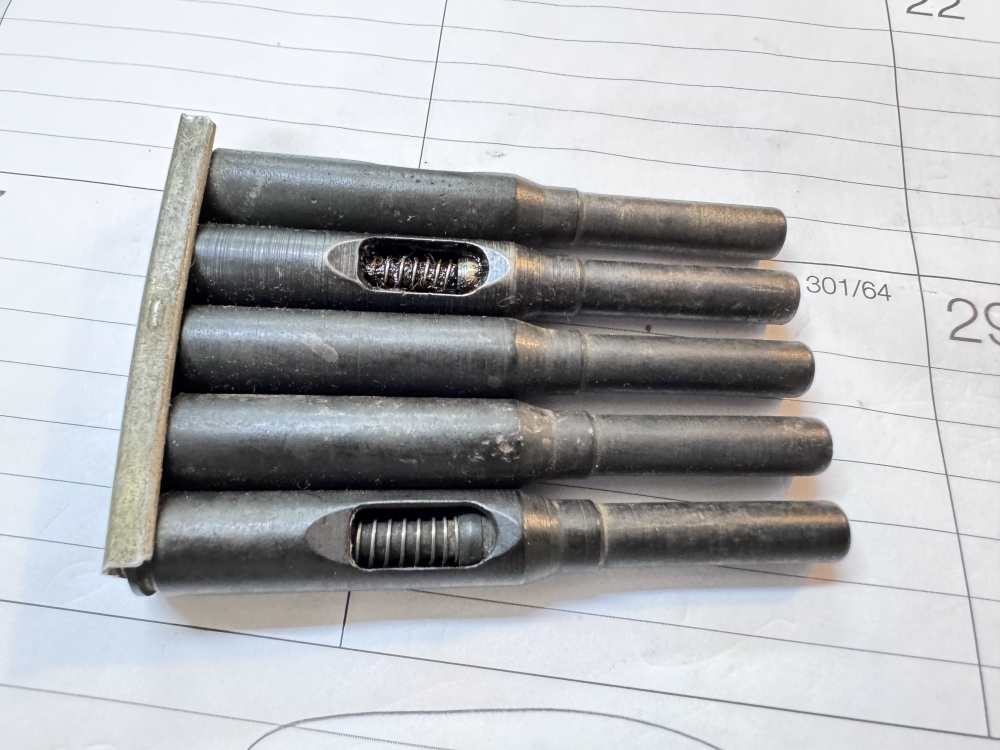 Original World War II Hoffer Thompson .22 adapter cartridges on strippers-img-0