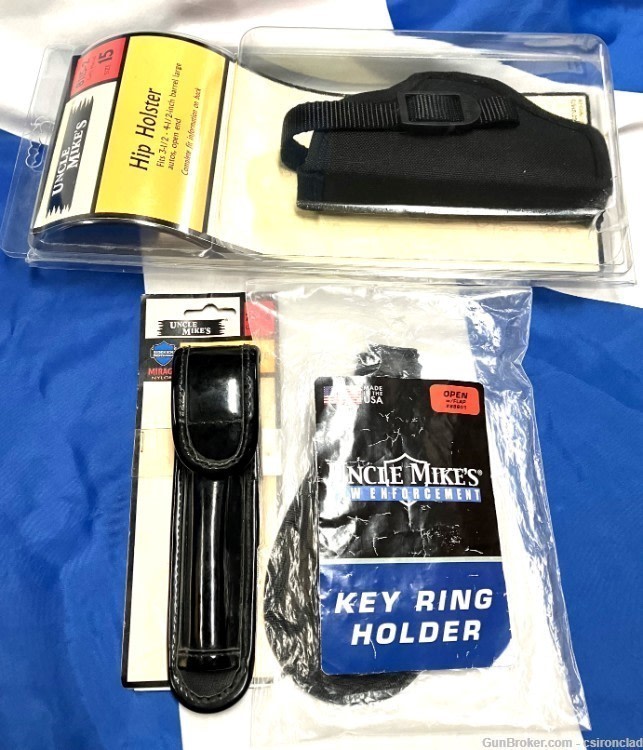 Uncle Mike's Security gear, 3 items, holster, flash holder, key ring. olnew-img-0